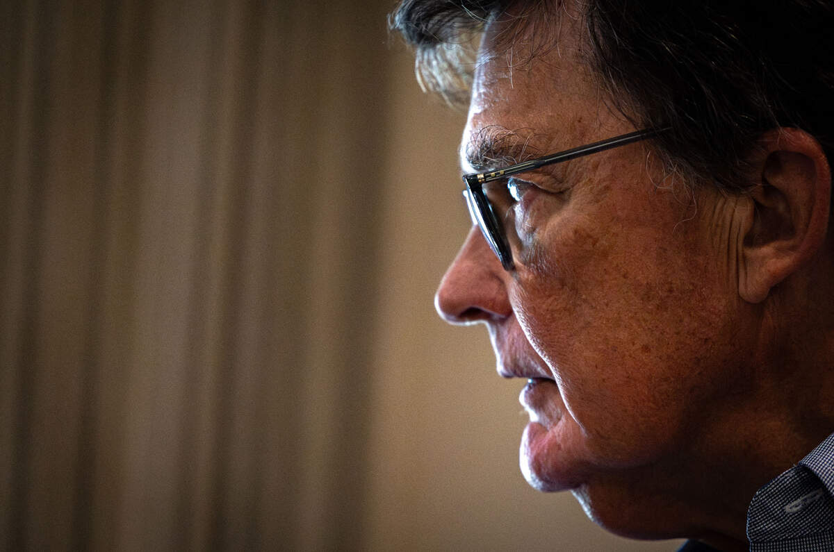 Michael Johnston stares out of a window inside of his home in Fort Worth on July 6, 2026. One of Johnston's biggest worries is that single family homes near Texas Christian University are being used as short-term rentals.